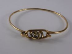 A 9 Ct Yellow and White Gold Knot Bracelet, approx 10.5 gms.