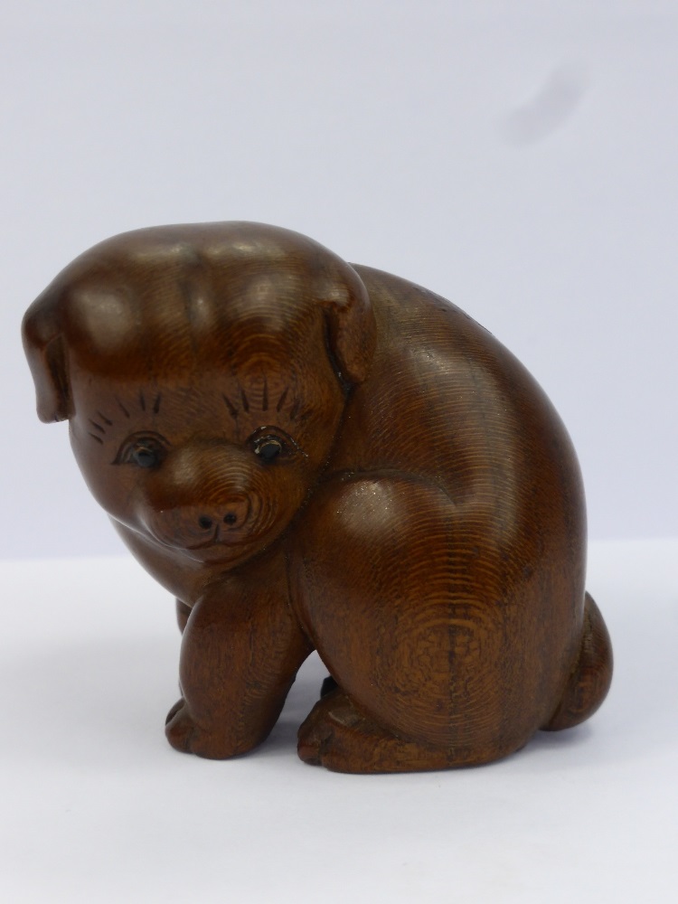 A Meiji Period Japanese Box Wood Netsuke, beautifully carved netsuke of a seated puppy, with a