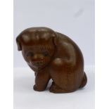 A Meiji Period Japanese Box Wood Netsuke, beautifully carved netsuke of a seated puppy, with a