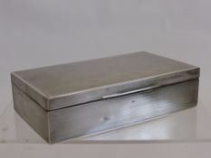 A Silver Double Cigarette Box, London hallmark, dated 1918, retailer Finnigans of New Bond Street,