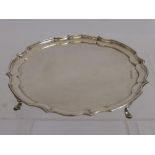 A Silver Card Tray, Sheffield Hallmark, dated 1946, with scalloped edge, supported on hoof feet,
