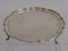 A Silver Card Tray, Sheffield Hallmark, dated 1946, with scalloped edge, supported on hoof feet,