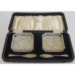 A Pair of Crystal Butter Dishes, with two silver butter knives in the original box, Birmingham