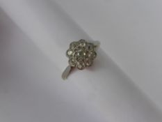 A Lady's 18 ct Antique Gold and Platinum Diamond Cluster Ring, size P, approx 50 pts of old cut