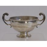 A Silver Golfing Trophy, on pedestal base with twin handles, London hallmark, approx 672 gms, mm