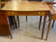 A Mahogany Writing Table, with single drawer on turned legs, approx 74 x 41 x 76 cms.