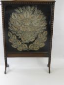 A Victorian Fire Screen, with decorated frame, the screen elaborately embroidery with pearls, approx