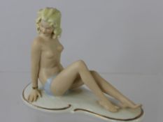 A Continental Bisque "Bathing Beauty", with factory marks to base nr. 960, approx 20 x 16 cms.