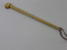 An Antique Bone Club, possibly Whalebone, approx 50 cms, the club handle tapered in length