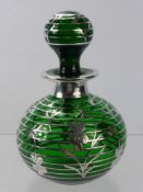 A Vintage Italian Green Glass Perfume Bottle, with silver overlay depicting flowers, approx 20 cms