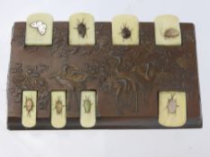 A Japanese Bronze Shibayama Counter, depicting insects.