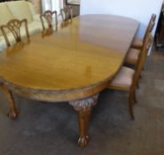 An Edwardian Mahogany Three Loose Leaf Wind Out Twelve Seater Dining Table, the table supported on