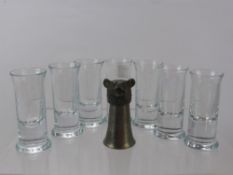 Seven 'Hongaard' Flat Bottom Shot Glasses, together with a Continental pewter spirit measure in