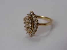 A Lady's 14 ct Yellow Gold and Diamond Ring, the Marquis shaped ring set with approx 47 pts dias,