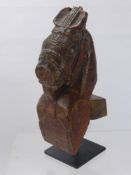 An Antique Indian Timber Support Carving, in the form of a horse on a stand, approx 34 cms high.