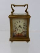 A Miniature French Brass Hand Painted Carriage Clock, porcelain side panels depicting cherubs