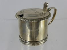 A Victorian Silver Mustard Pot, hinged lid with thumb piece, engine turned lid with roped edge