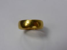 A Gentleman's 22 ct Gold Wedding Band, London hallmark, mm rubbed, dated 1971, size M, approx 6.8