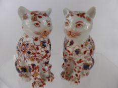 A Pair of Japanese Imari Seated Cats, marks to base, approx 14 cms, the palette of orange, red and