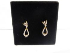 A Pair of Lady's 18 ct Gold and Diamond Drop Earrings, approx 2.6 gms, approx dia wt 30 pts.