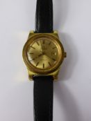 A lady's vintage Omega automatic wrist watch. the watch having a gold coloured face with baton