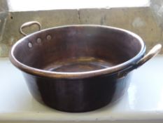 A Large Vintage Copper Basin with handles, approx 38 x 16 cms.