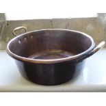 A Large Vintage Copper Basin with handles, approx 38 x 16 cms.