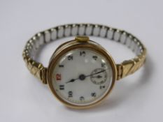 A Lady's 9ct Gold Pocket Watch, the open faced vintage pocket watch, having white enamel face with