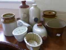 A Quantity of Stoneware, including two jelly moulds and four vintage hot water bottles.