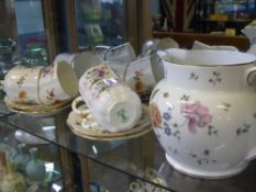 A Part Royal Crown Derby 'Derby Posies' Tea Set, comprising seven saucers, five coffee (green back