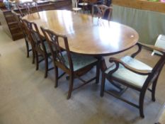 A Good Quality Mahogany Six Seater Regency Style Oval Extending Dining Table, two turned column