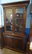 An Antique Mahogany Glazed Front Book Case, with three internal shelves, a candle drawer with two