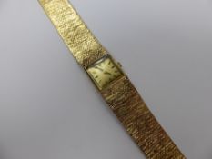 A Lady's 9ct Gold Omega Cocktail Watch, having solid gold bark finish bracelet with gold face and