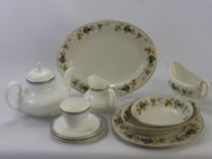 A Royal Doulton Part Dinner Service "Larchmont", two vegetable serving dishes, oval meat platter,