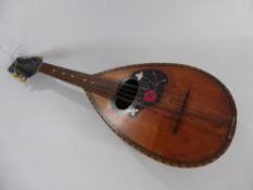 A Vintage Neapolitan Guiseppe Quaglia Mandolin, circa 1900 the eight string mandolin with decorative