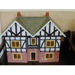 A Wooden Doll's House, with many fittings and furniture, approx 73 x 55 x 35 cms.