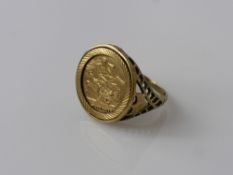 A 9 ct Yellow Gold Sovereign Style Ring, size W, approx wt 6.9 gms.