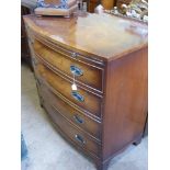 A Georgian Style Bow Fronted Mahogany Inlaid Chest of Drawers, the chest having four graduated