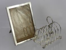 A Silver Toast Rack, Sheffield hallmark dd 1903, mm Walker & Hall, together with a silver photo