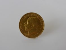 A 1914 George V Solid Gold Half Sovereign.