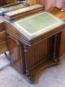 A Mahogany Reproduction Davenport, the Davenport having four drawers to side with column supports