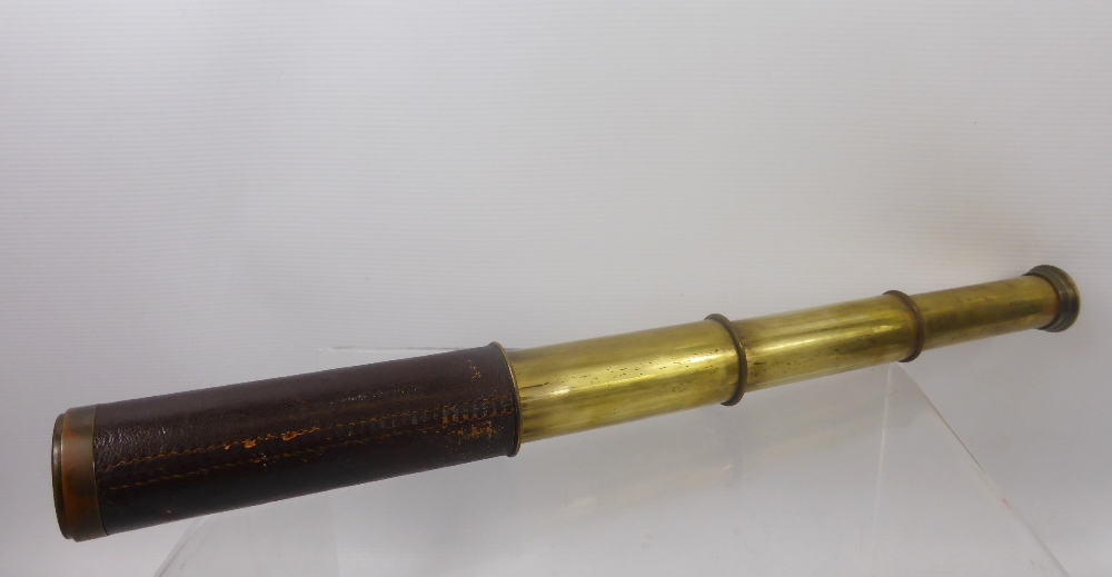 A Vintage Dolland (London) Brass and Leather, four draw telescope.