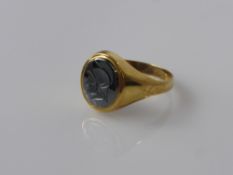 A 9 ct Gold Gentleman's Signet Ring, with black onyx figure of a centurion, size V, approx wt 4.2