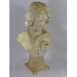 A Cream Carrara Marble Bust of a Modest Young Woman, with flowing locks over one shoulder and