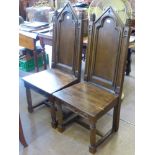 Two Oak Hall Chairs in the Gothic Style, turned legs on straight stretchers with decorative