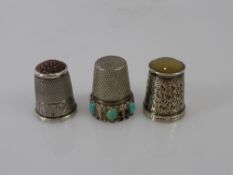 A Quantity of Silver Sewing Thimbles, including seventeen hallmarked including two amber topped