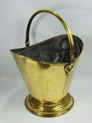 A Victorian Brass Helmet Coal Bucket, with original liner.