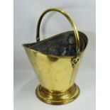 A Victorian Brass Helmet Coal Bucket, with original liner.