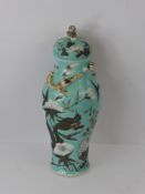 A Chinese Baluster Vase and Cover, turquoise glaze hand painted with white chrysanthemum, chasing