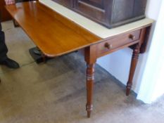 An Oak Pembroke Table, with single drawer to one side, raised on turned tapered legs, approx 110 x